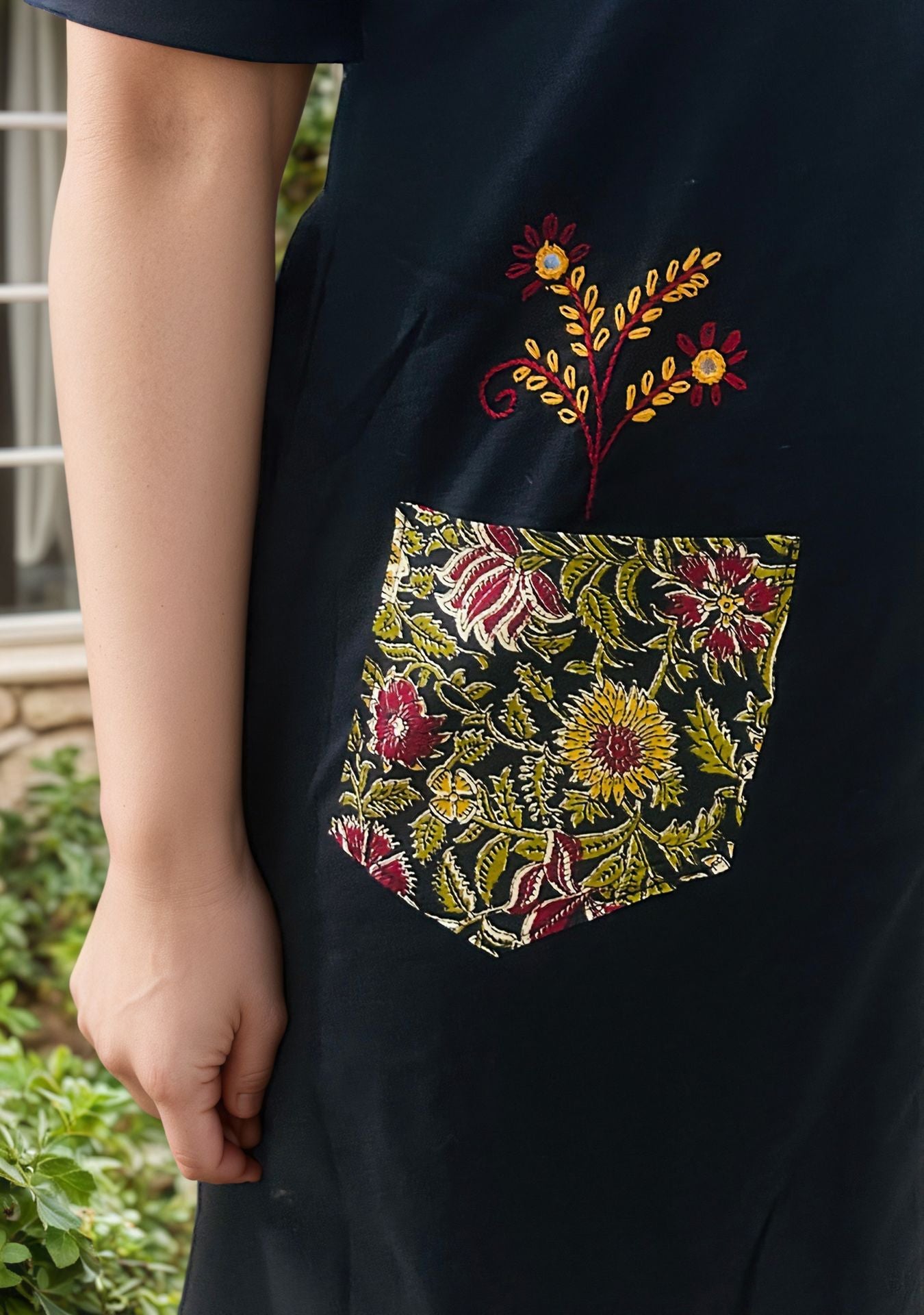Black kurti with floral designs and floral plazo pair